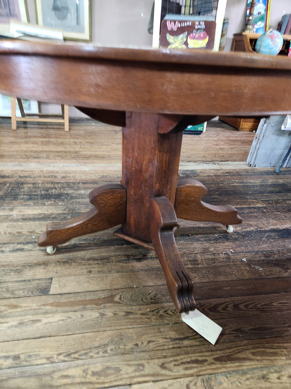 Antique Round Oak Pedestal Dining Table with Down-swept Scroll Feet & Caster Wheels