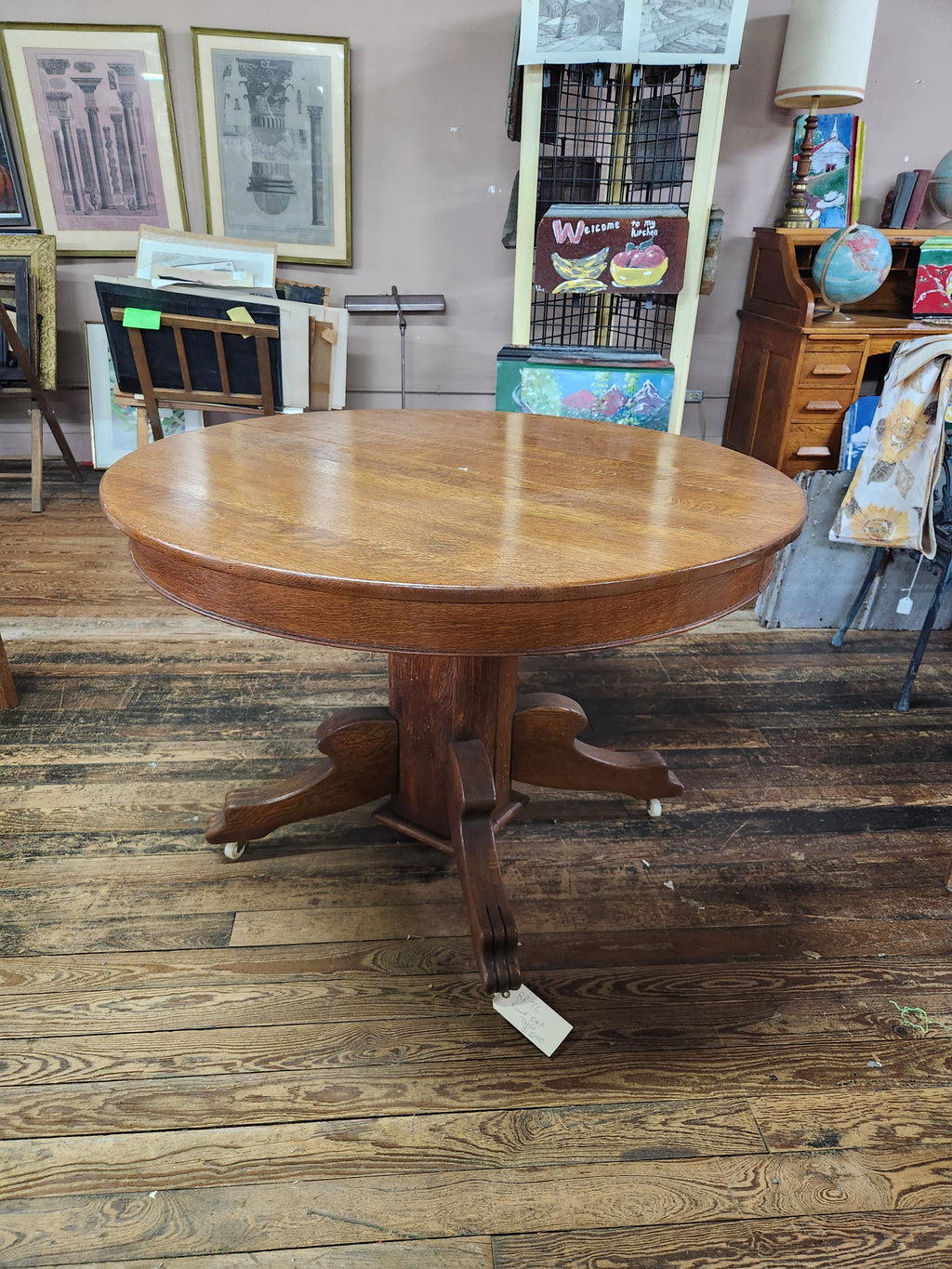 Antique Round Oak Pedestal Dining Table with Down-swept Scroll Feet & Caster Wheels