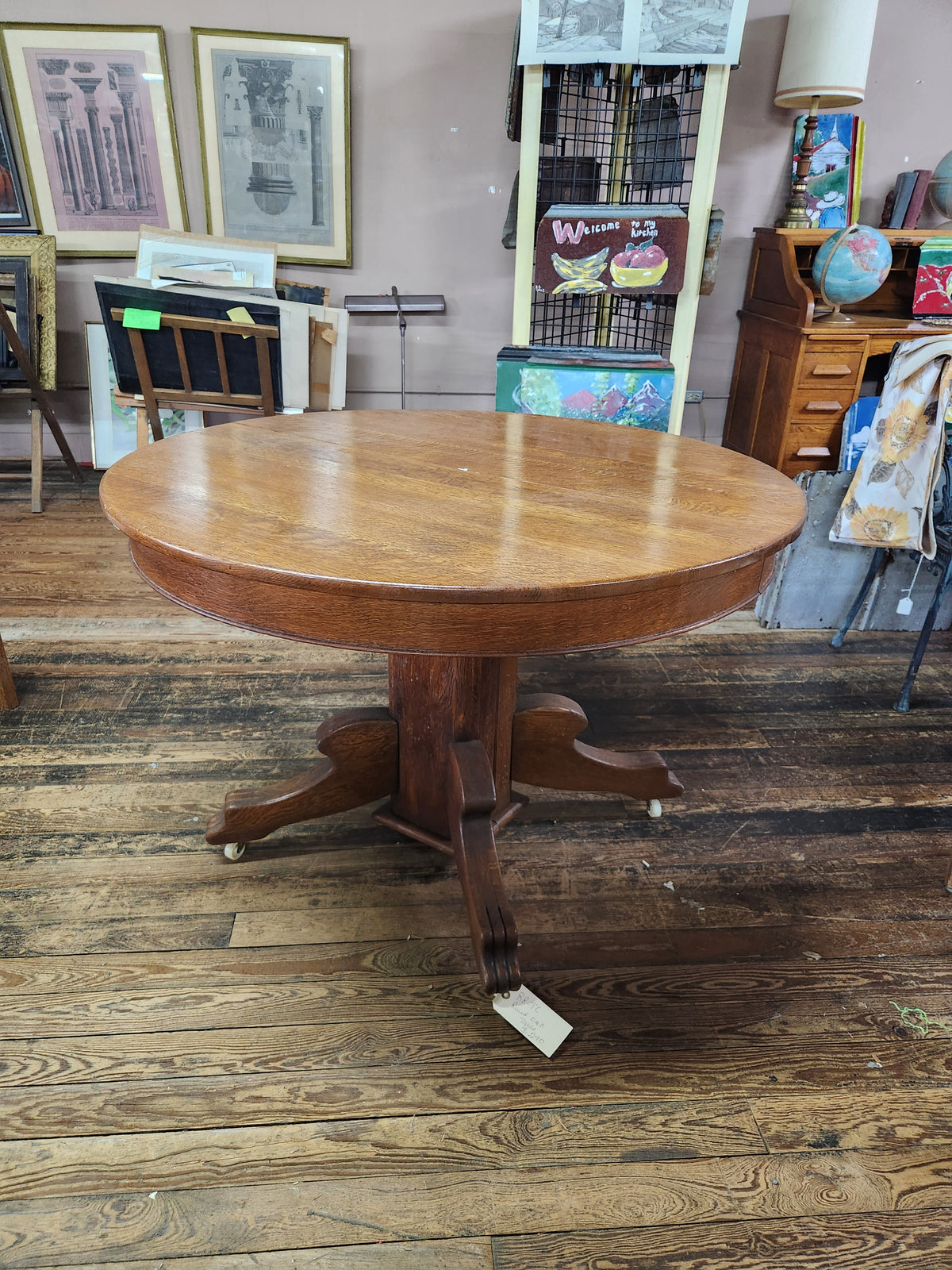 Antique Round Oak Pedestal Dining Table with Down-swept Scroll Feet & Caster Wheels