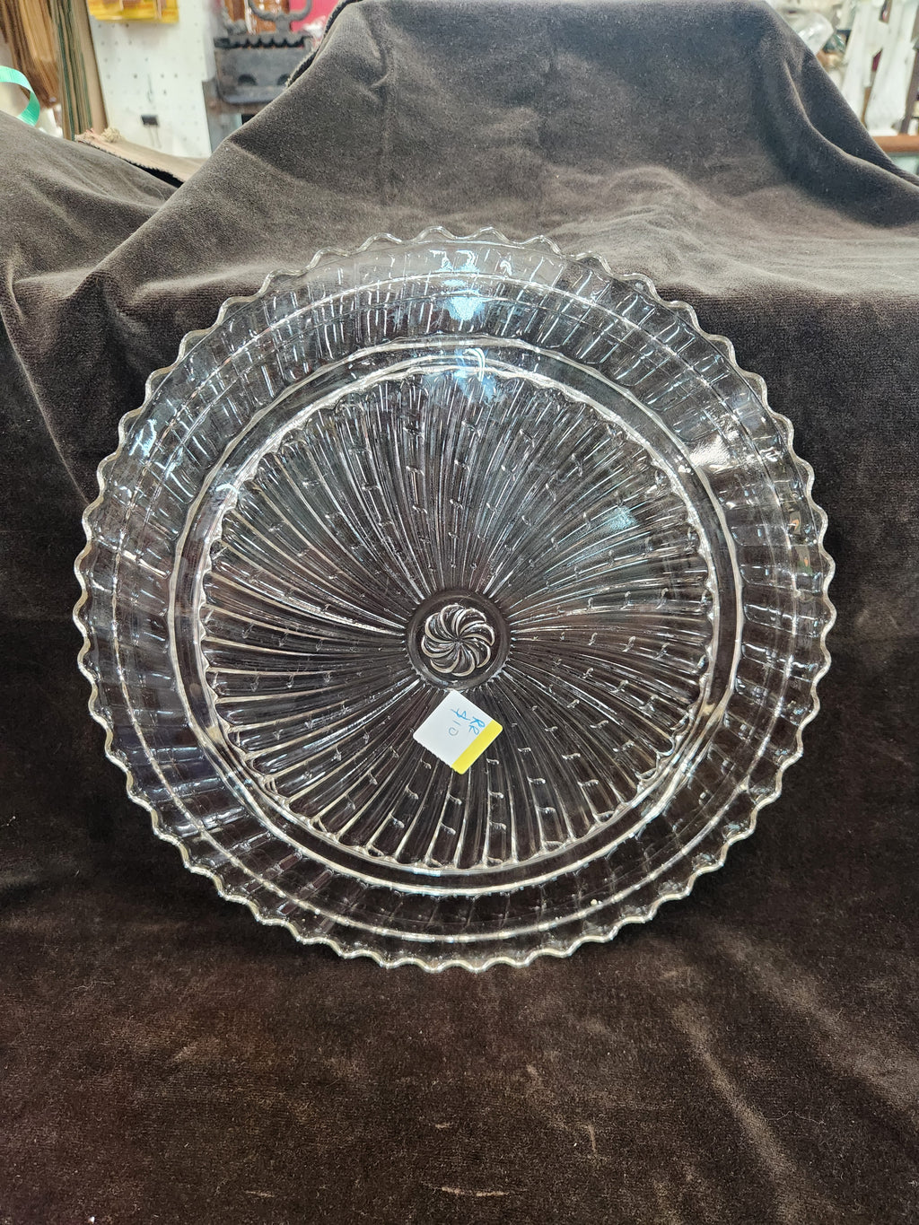 Clear Pressed Glass Cake Plate Featuring a Radiating Swirl Pattern and a Scalloped Rim