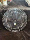 Clear Pressed Glass Cake Plate Featuring a Radiating Swirl Pattern and a Scalloped Rim