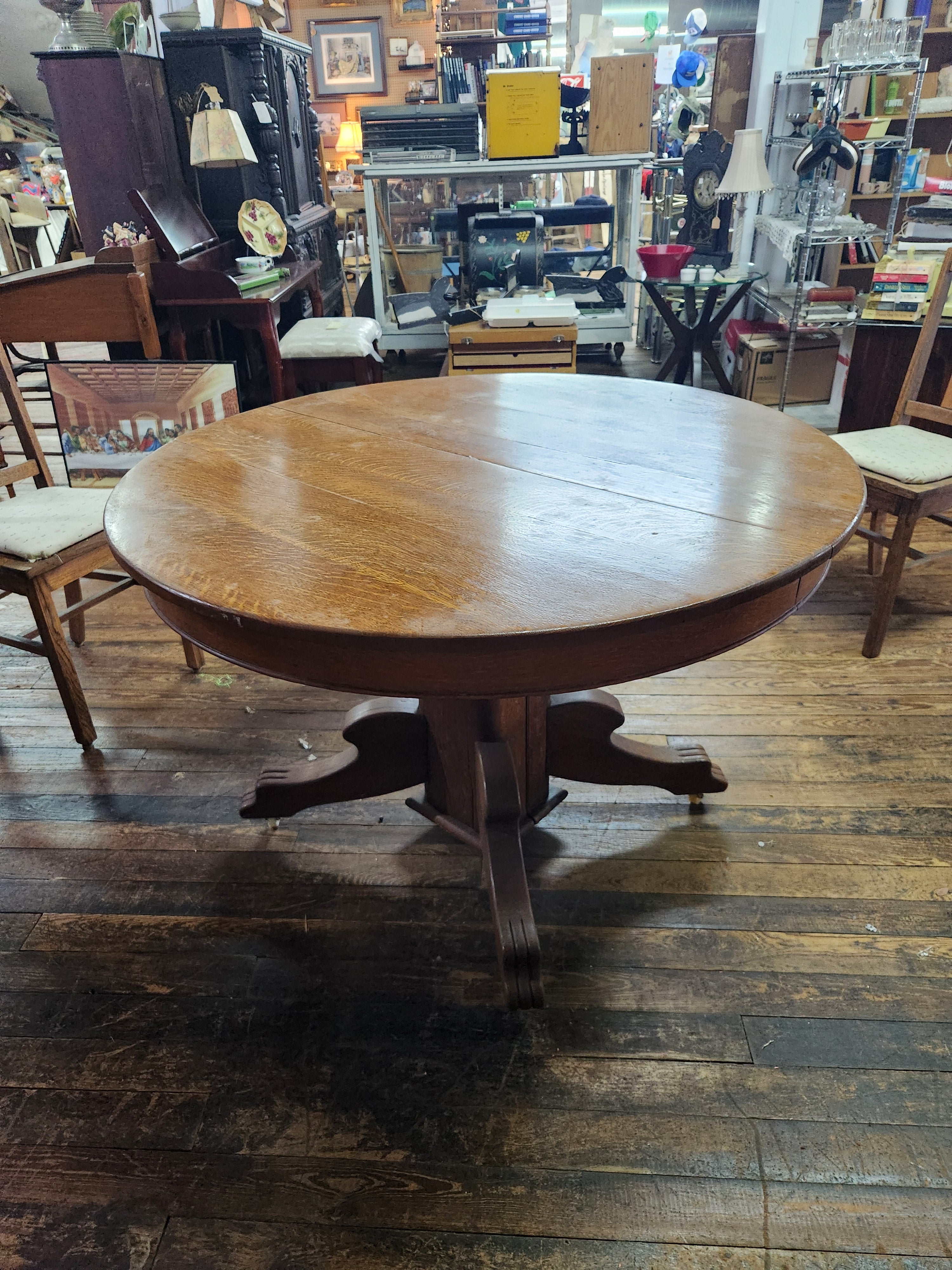 Antique Round Oak Pedestal Dining Table with Down-swept Scroll Feet & Caster Wheels