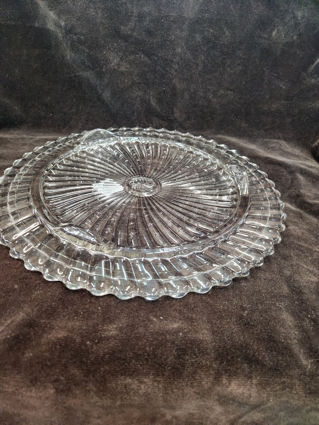 Clear Pressed Glass Cake Plate Featuring a Radiating Swirl Pattern and a Scalloped Rim